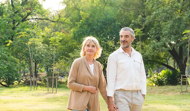 middle age couple walking outside