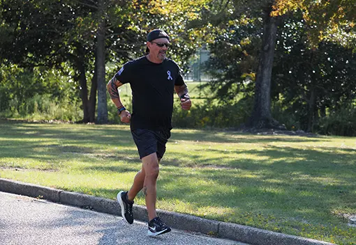 A patient running outdoors