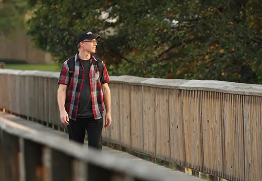 Patient Chris Walking on Pier